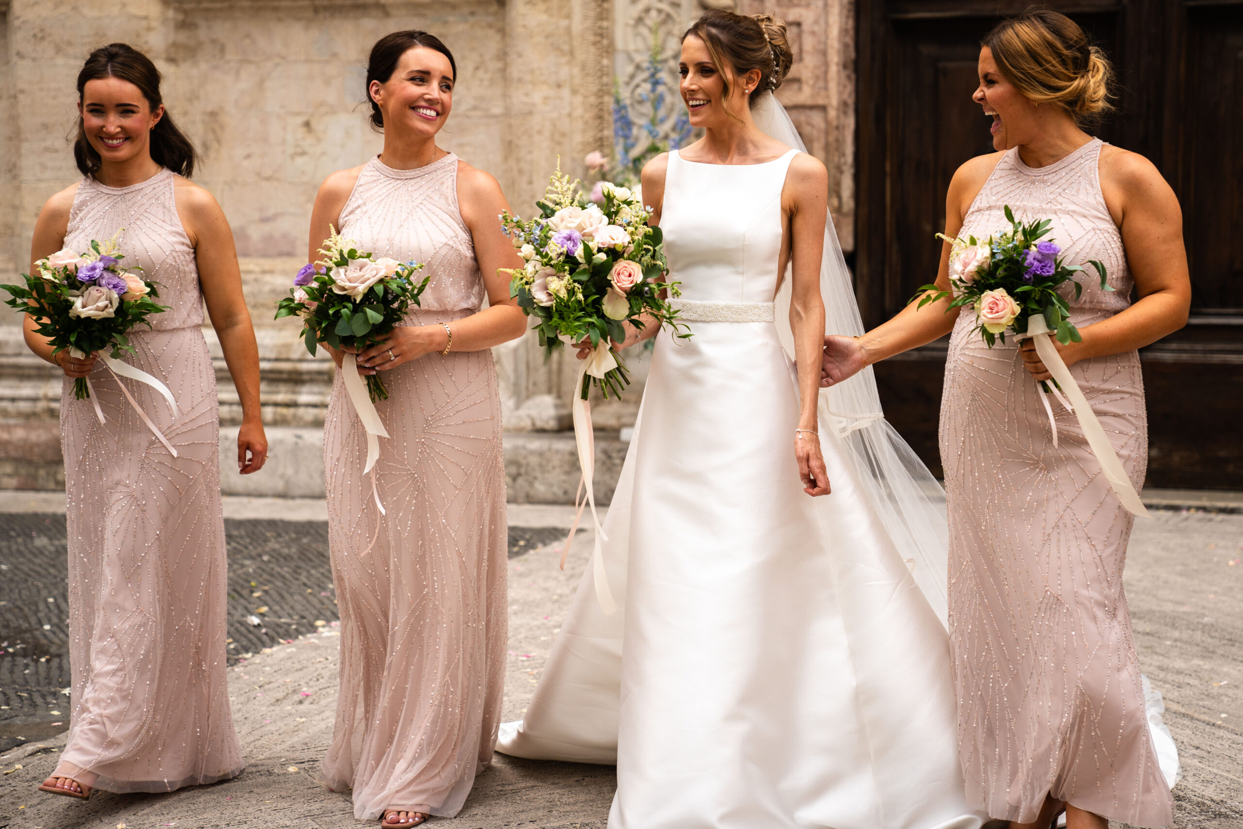 Bridesmaids outside the chapel of Assisi photographed by London wedding destination photographer