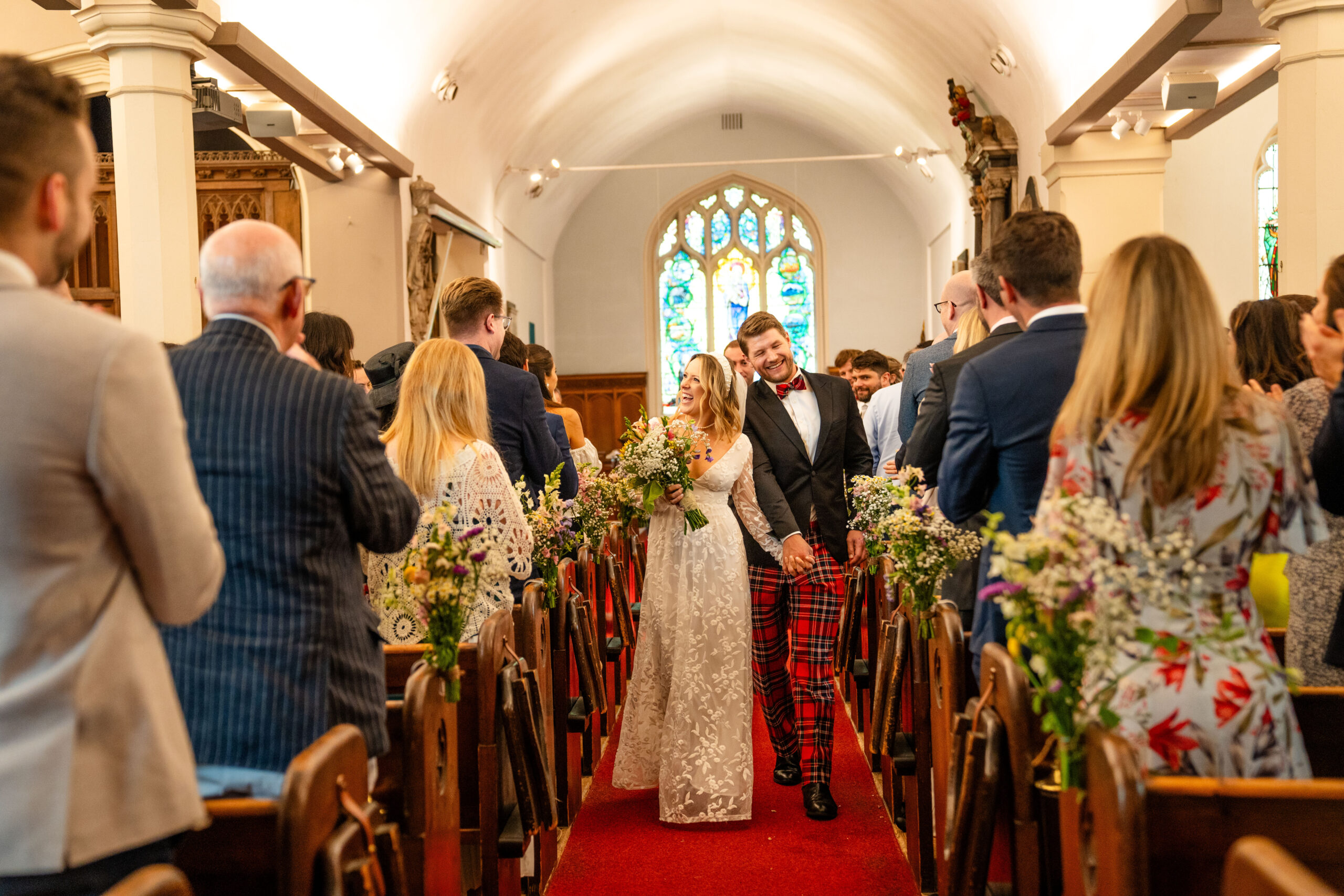 Richmond wedding photographer, bride and groom walking down the isle 