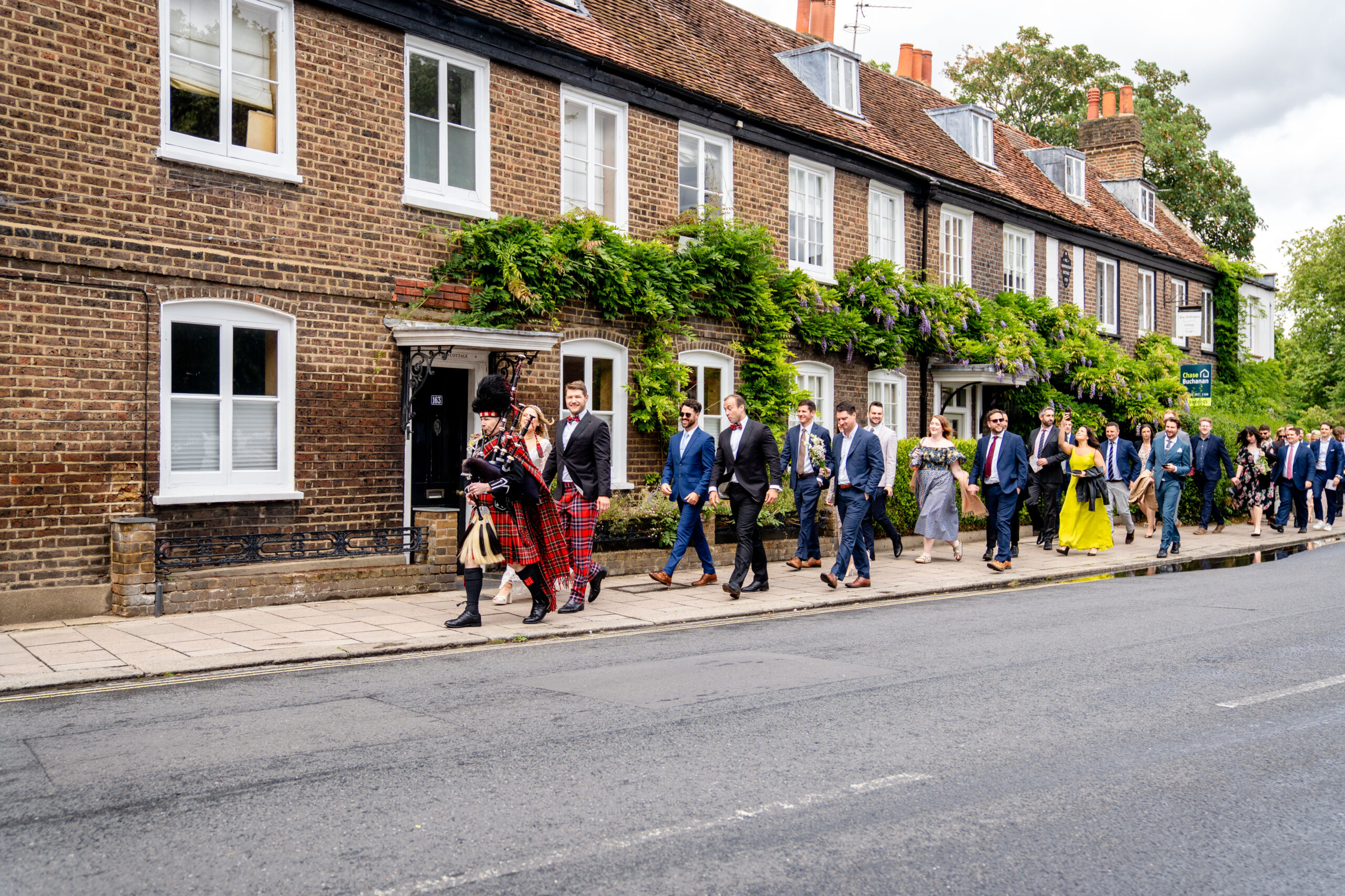 Wedding guests and party walking to reception captured by Richmond wedding photographer